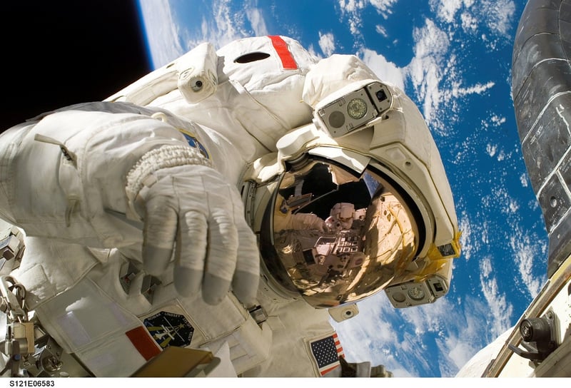 Astronaut performing resistance training in zero gravity